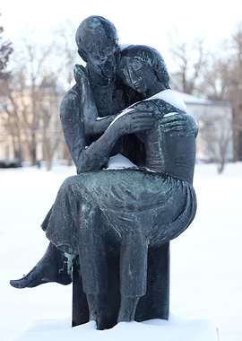 Bronze Sculpture of Embracing Couple in Snow