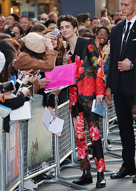 Timothée Chalamet in floral suit with fans