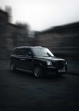 Black London Taxi in Motion