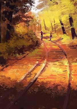Two people cycling on train tracks in autumn