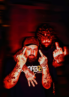 Two men with tattoos and middle fingers up