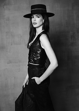 Anne Hathaway in a Black Hat and Vest