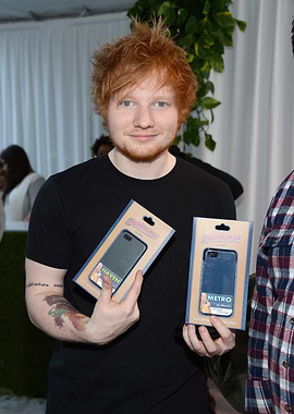 Ed Sheeran holding phone cases