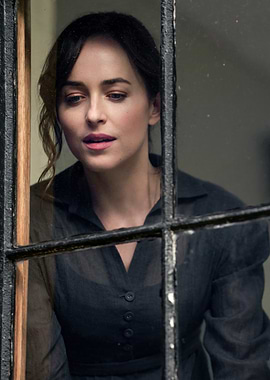 Dakota Johnson looking out a window