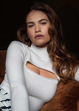 Lily James in a white cutout sweater