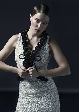 lea seydoux in textured dress with black trim