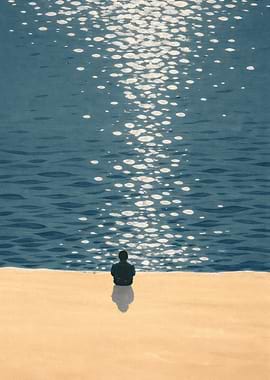 Person sitting by the sea
