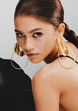 Zendaya in Dramatic Gold Earrings