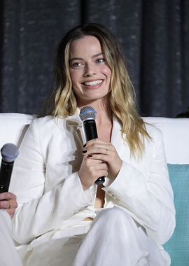 Margot Robbie in a white suit