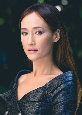 maggie in a dark textured jacket