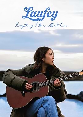 Laufey playing guitar