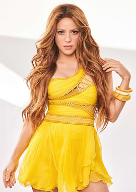 Shakira in a yellow dress