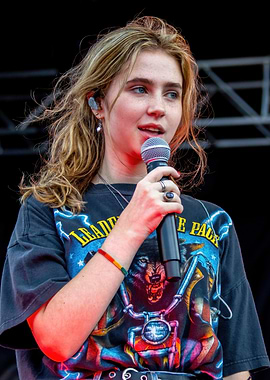 clairo Singer with microphone on stage