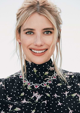 Emma Roberts smiling with heart necklace