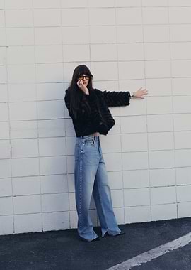Woman in faux fur jacket and jeans