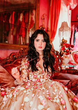laura marano in floral dress on ornate couch