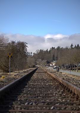 Train tracks leading to a village