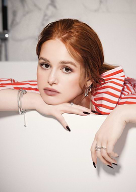 Madelaine Petsch in a bathtub with red and white striped shirt