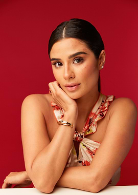 Diane Guerrero with floral top and bracelet