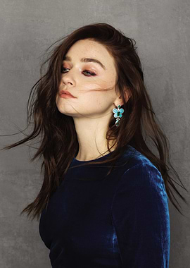 Jessica Barden in Blue Velvet Dress with Flower Earrings