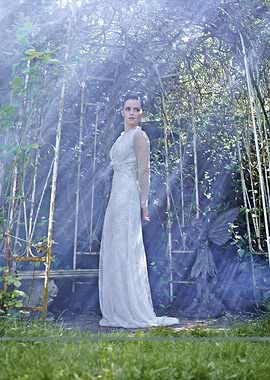 Woman in a white gown in a garden