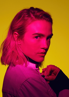 Maddie Hasson in pink and yellow lighting