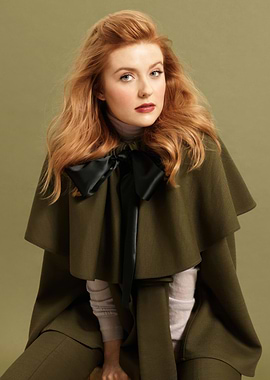 Kennedy McMann in green cape with bow
