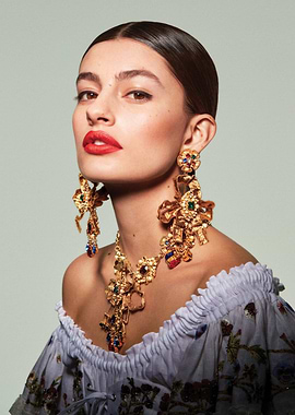 Diana Silvers with ornate jewelry and red lipstick