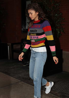 Zendaya in a colorful striped sweater