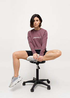 Lena Meyer-Landrut in athletic wear sitting on a chair