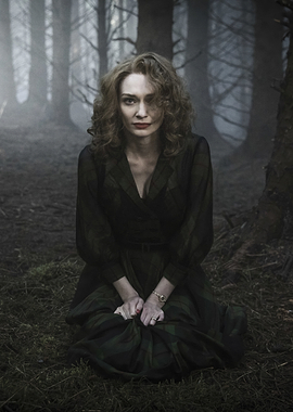 Eleanor Tomlinson in a dark forest