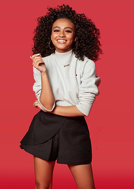 Daniella Perkins Posing Against Red Background