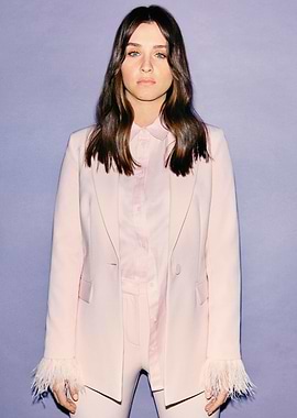 Brooke Vincent in pink suit with feather cuffs