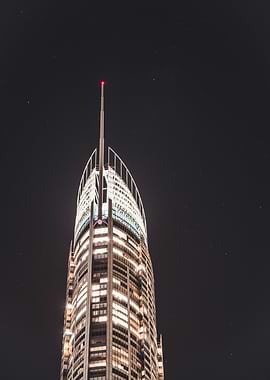 Skyscraper at Night with Stars