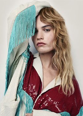 Lily James in sequined jacket with fringe
