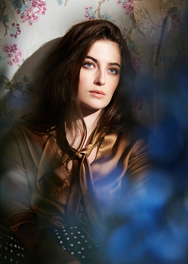 Millie Brady in Silk Blouse with Floral Wallpaper
