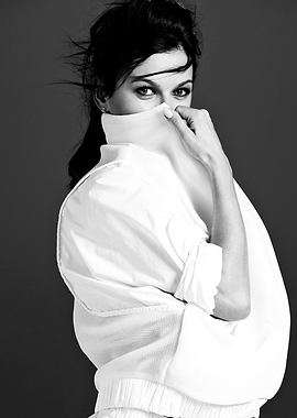 Anna Lewandowska in white turtleneck and jacket