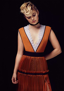 Olivia Holt in Orange Pleated Dress