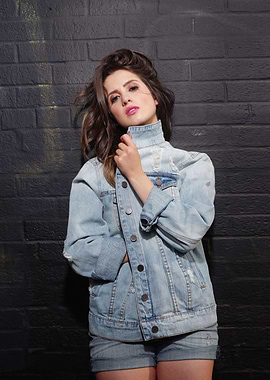 Laura Marano in Denim Jacket and Shorts