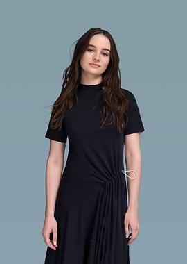 Aisling Franciosi in a black dress