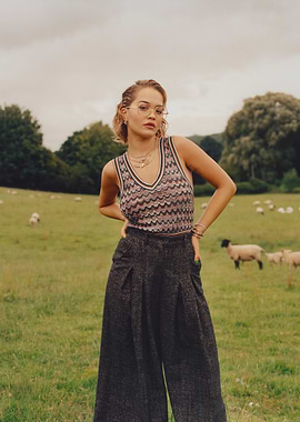 Rita Ora in a field with sheep