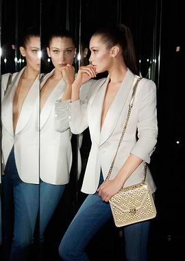 Bella Hadid in a white blazer and jeans