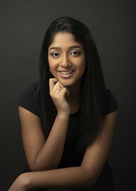 Maitreyi Ramakrishnan with hand on chin