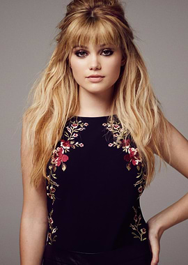 Olivia Holt with Blonde Hair and Floral Top
