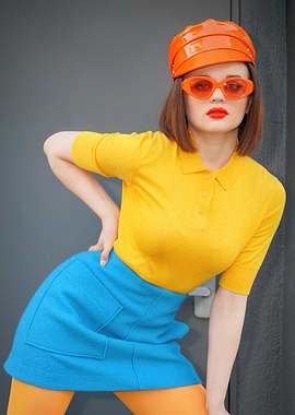 Joey King in bright fashion with orange accessories