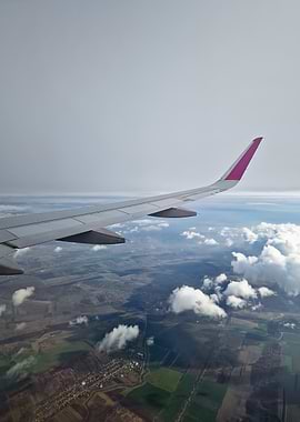 Airplane wing over landscape