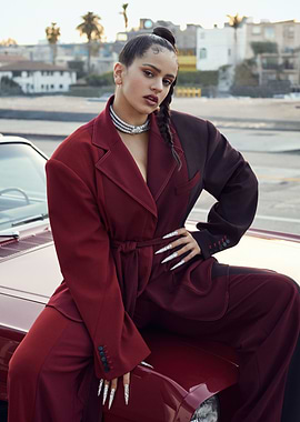 Rosalía Poses in a Burgundy Suit