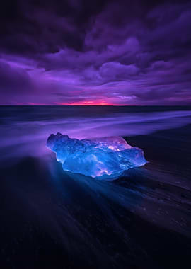 Iceberg on a Black Sand Beach at Sunset