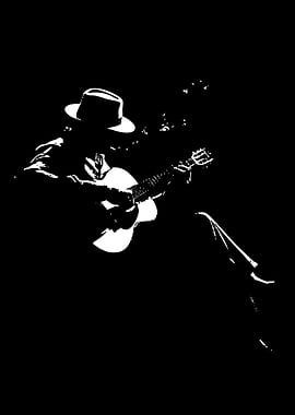 Musician Playing Guitar in Silhouette