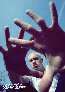 Eminem framed by hands against blue sky